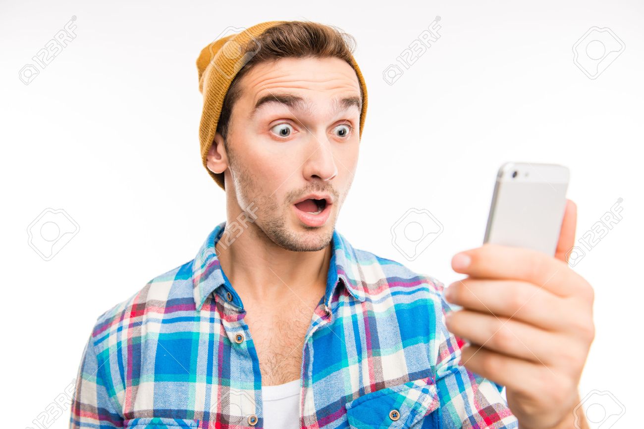 49696688-a-portrait-of-surprised-young-man-with-mobile-phone.jpg