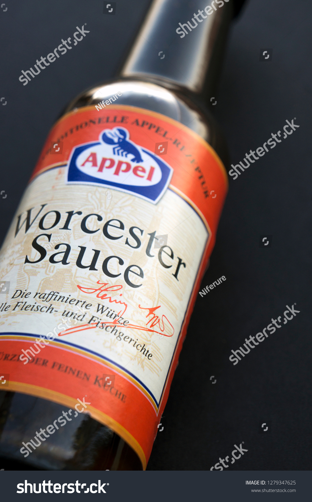 stock-photo-krasnodar-russia-january-bottle-of-worcester-sauce-by-apple-on-black-background-1279347625.jpg