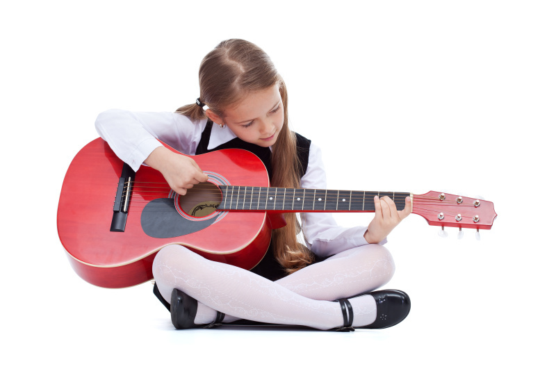 fotolia_64334515_little_girl_with_red_guitar__sitting.jpg